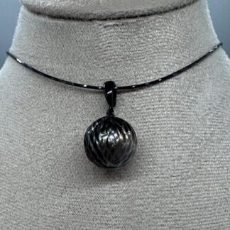 Carved Tahitian Pearl Pendant on Black Necklace